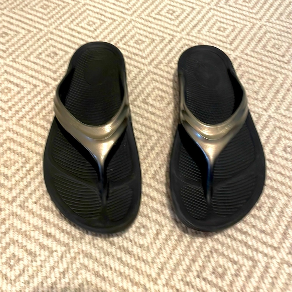 Women’s Koufos sandals
Black with gray metallic upper
Size: US W 10, EU 41